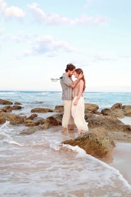 Romantic engagement photography session in Palm Coast, Florida, featuring a couple embracing outdoors in natural light.