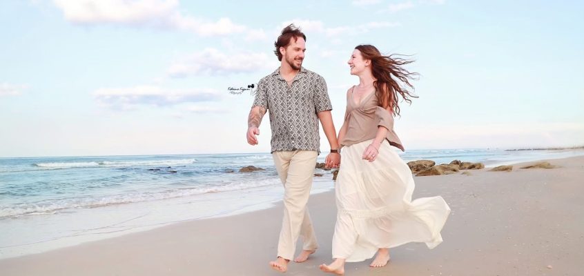 Romantic engagement photography session in Palm Coast, Florida, featuring a couple embracing outdoors in natural light.
