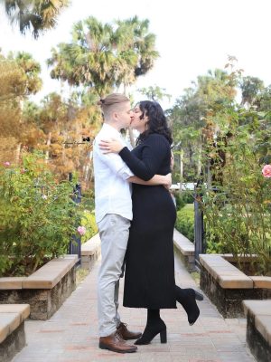 Engaged couple under oak trees at Washington Oaks Gardens.