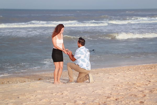 Engagement proposal on the beach at Washington Oaks Gardens.