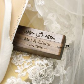 Close-up wedding photography of a wedding dress, shoes and names tag, capturing the elegant details of the wedding day.